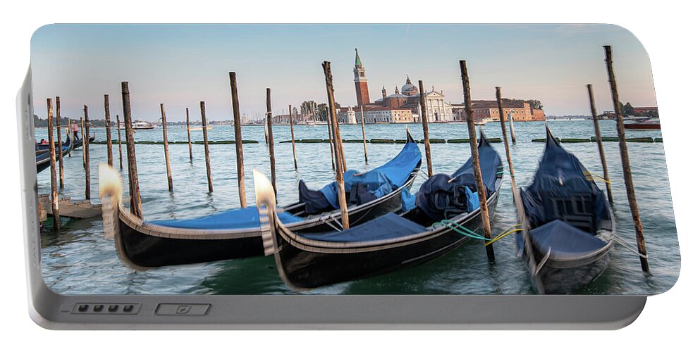 Gondola Portable Battery Charger featuring the photograph Venice Gondolas moored at the San Marco square. #2 by Michalakis Ppalis