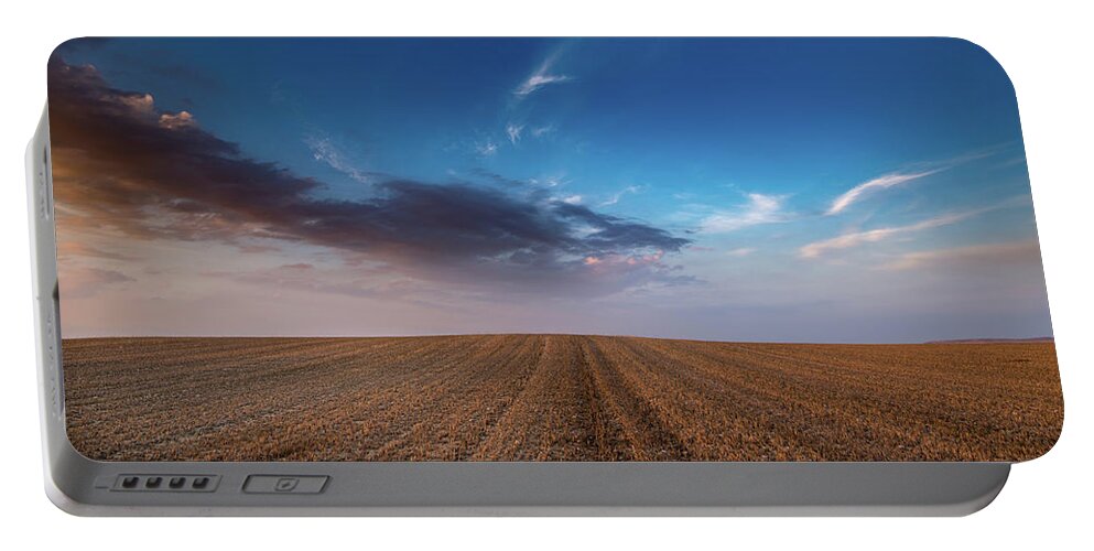 Nightfall Portable Battery Charger featuring the photograph Agricultural meadow field and cloudy sky during sunset. by Michalakis Ppalis