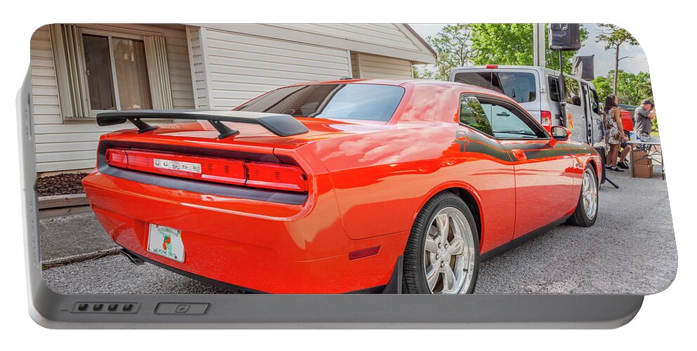 Dodge Portable Battery Charger featuring the photograph 2010 Orange Dodge Challenger RT Hemi X134 by Rich Franco