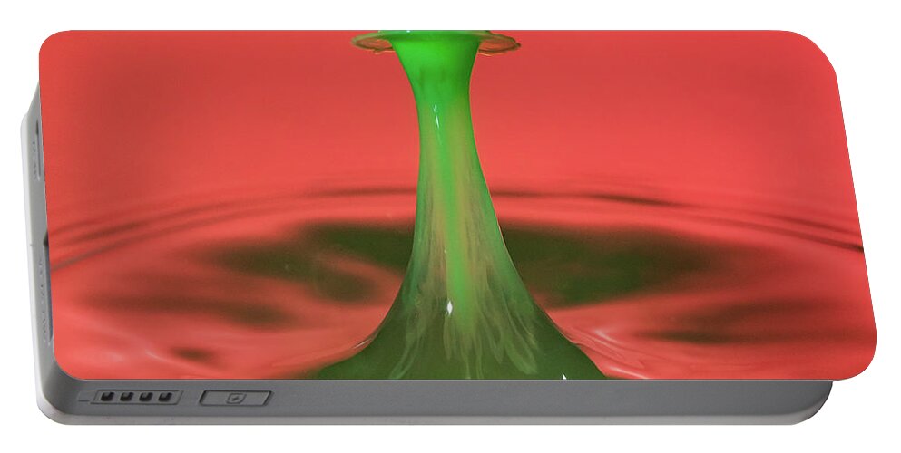Waterdrop Portable Battery Charger featuring the photograph Water drop falling onto column of water #3 by Steven Heap