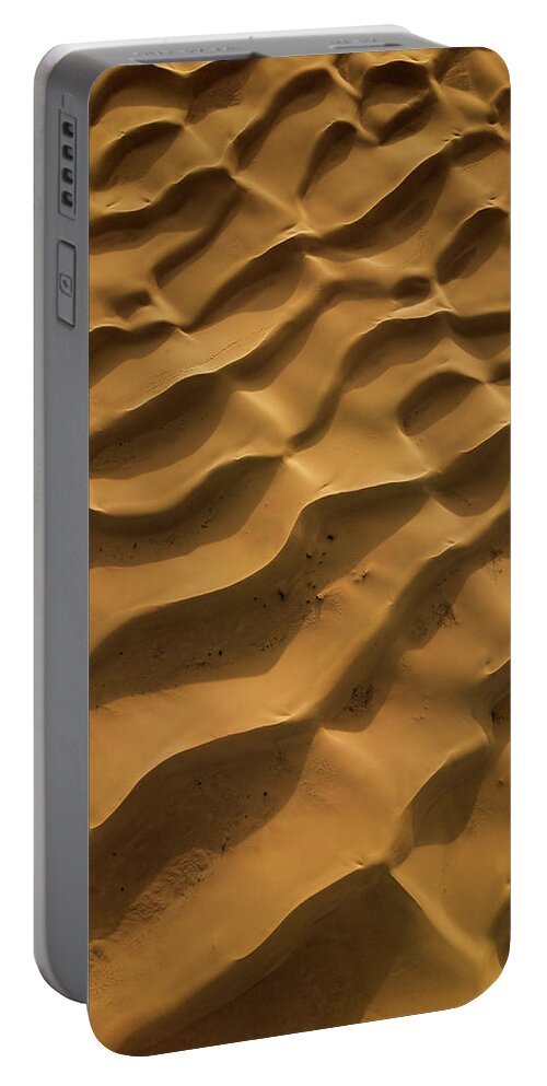 Aerial Portable Battery Charger featuring the relief Aerial top view on sand dunes in desert #4 by Mikhail Kokhanchikov
