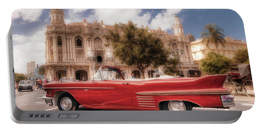 La Habana Portable Battery Charger featuring the photograph A Cadillac and the Hotel Inglaterra by Micah Offman