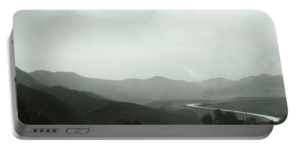Mountains Portable Battery Charger featuring the photograph A Distant Road by Kathleen Grace
