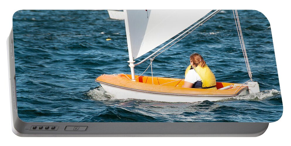 Csne57 Portable Battery Charger featuring the photograph A female sailor Sailing small sailboat solo on an inland waterwa by Geoff Childs