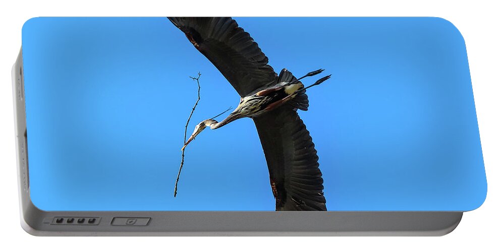 Great Blue Heron Portable Battery Charger featuring the photograph A Great Blue Heron in Flight by Tahmina Watson