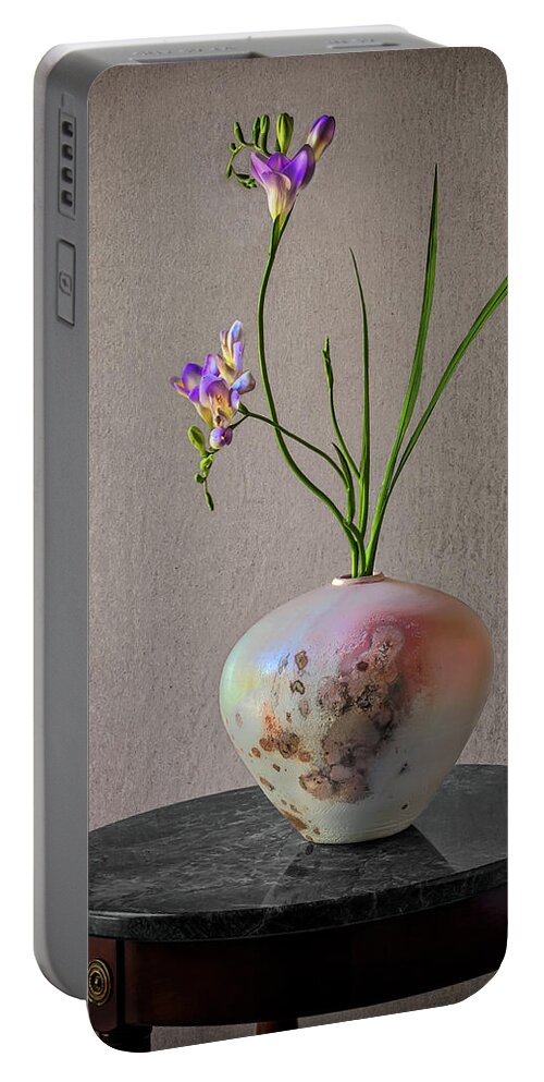 Freesia Portable Battery Charger featuring the photograph A Raku Vase With Freesias by Endre Balogh