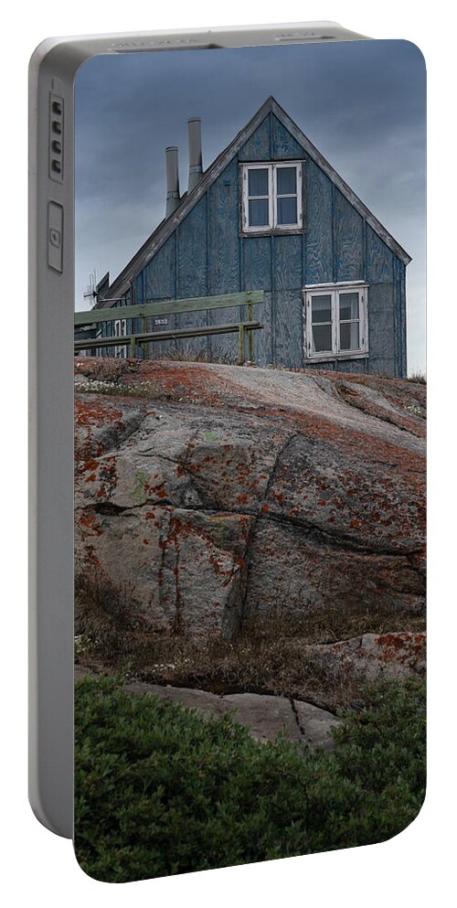Greenland Portable Battery Charger featuring the photograph A wooden house in Disco bay by Anges Van der Logt