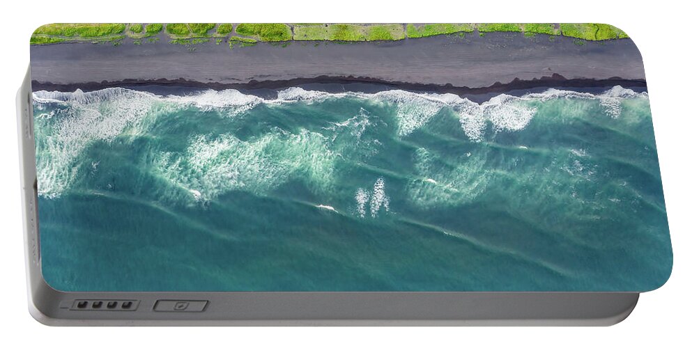 Beach Portable Battery Charger featuring the photograph Aerial top view of beach with black sand by Mikhail Kokhanchikov