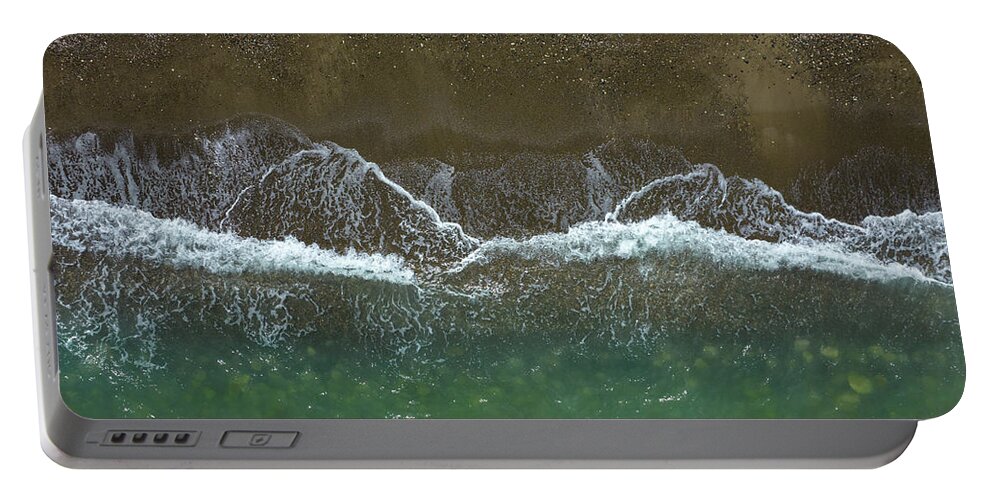 Waves Portable Battery Charger featuring the photograph Aerial view ocean waves braking on a sandy beach. Nature background by Michalakis Ppalis