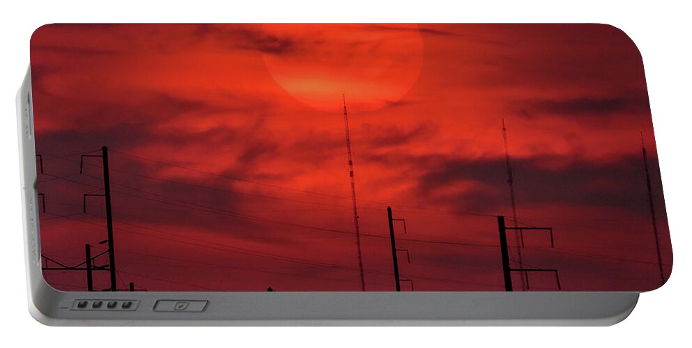 Sunset Portable Battery Charger featuring the photograph Airplane Passing in Front of Setting Sun Over Philadelphia by Linda Stern