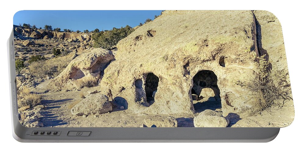 America Portable Battery Charger featuring the photograph Ancient pueblo dwellings in Tsankawi by Alexey Stiop