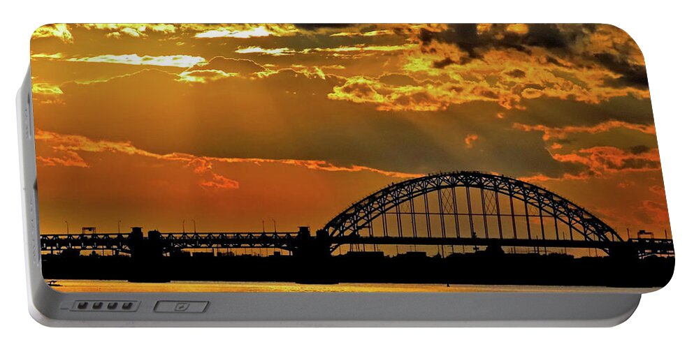 Sunset Portable Battery Charger featuring the photograph Autumn Sunset Behind Tacony-Palmyra Bridge on the Delaware by Linda Stern