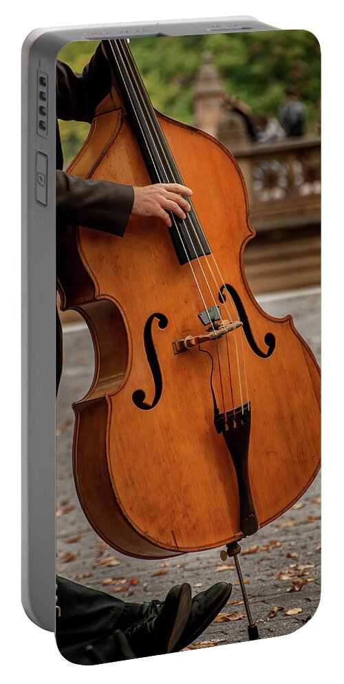 Central Park Portable Battery Charger featuring the photograph Bass Player in the Park by Phil Cardamone