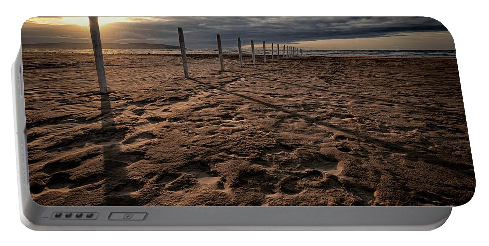 Downhill Portable Battery Charger featuring the photograph Benone Beach Posts by Nigel R Bell