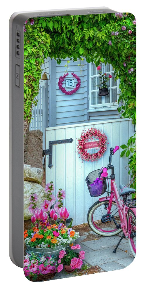 Spring Portable Battery Charger featuring the photograph Bicycle Waiting at the Garden Gate by Debra and Dave Vanderlaan