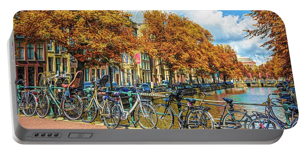 Amsterdam Portable Battery Charger featuring the photograph Bicycles Along the Canals in Autumn by Debra and Dave Vanderlaan