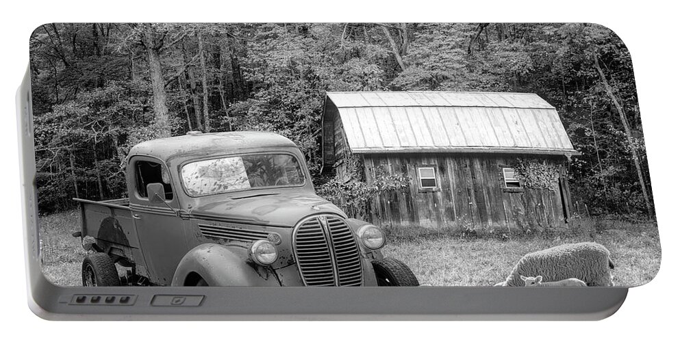Black Portable Battery Charger featuring the photograph Big Chevy on the Farm Black and White by Debra and Dave Vanderlaan
