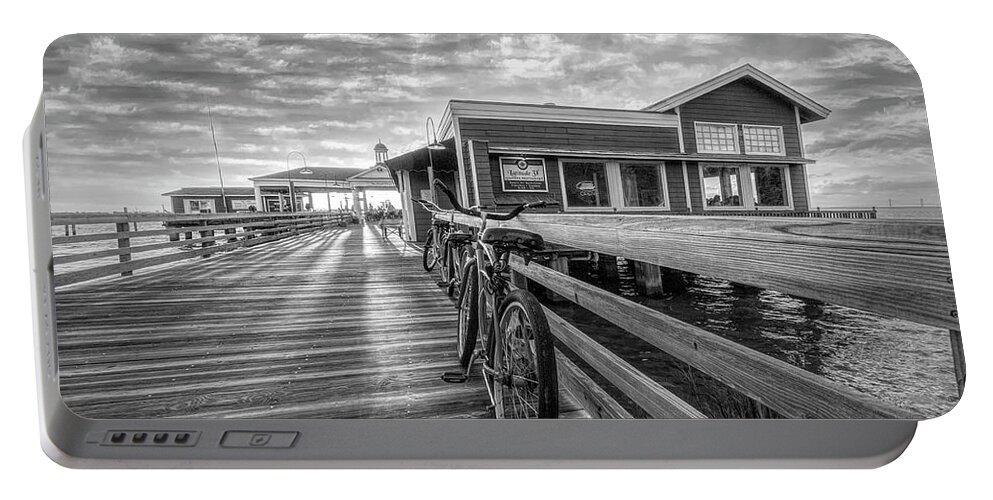 Clouds Portable Battery Charger featuring the photograph Blue Bicycles on the Jekyll Island Boardwalk Pier Black and Whit by Debra and Dave Vanderlaan