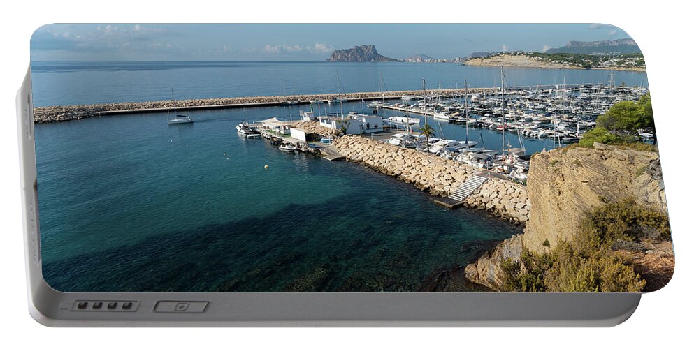 Mediterranean Coast Portable Battery Charger featuring the photograph Blue Mediterranean Sea and marina in Moraira 2 by Adriana Mueller