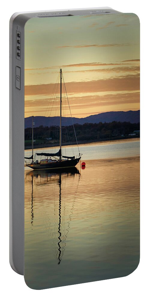 Blue Portable Battery Charger featuring the photograph Boat On A Lake at Sunset by Rick Deacon