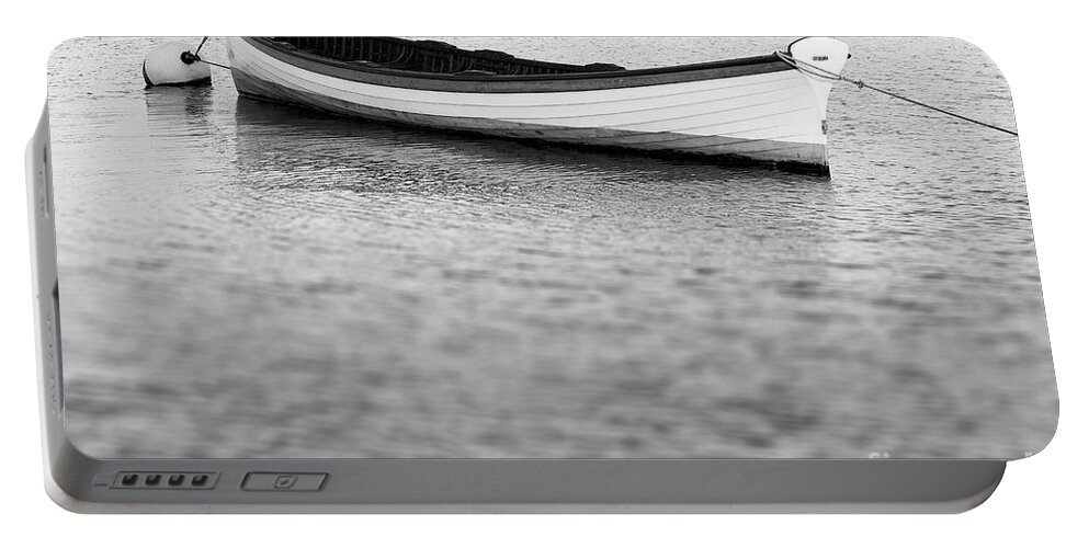 Canoe Portable Battery Charger featuring the photograph Canoe in harbor by Tony Cordoza