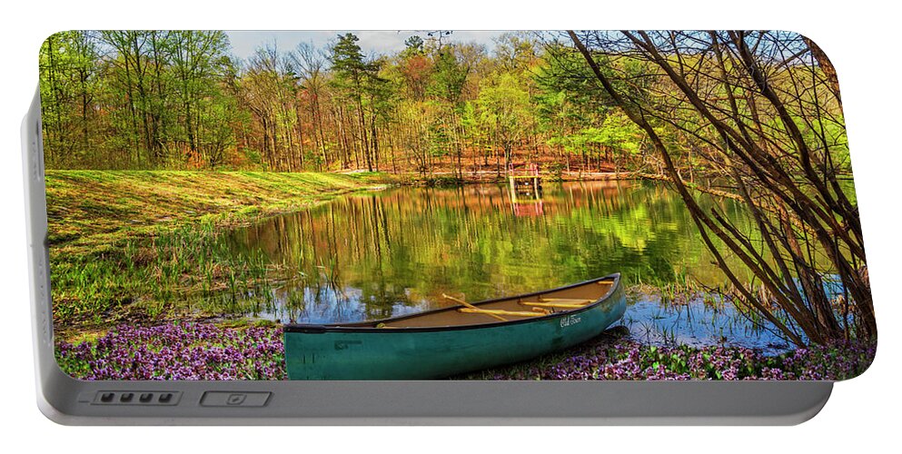 Benton Portable Battery Charger featuring the photograph Canoe in the Spring Wildflowers at the Lake by Debra and Dave Vanderlaan
