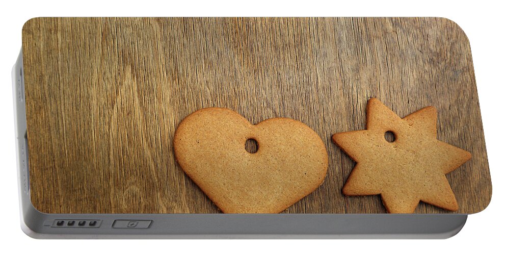 Christmas Portable Battery Charger featuring the mixed media Christmas gingerbread cookie over wooden table by Mikhail Kokhanchikov