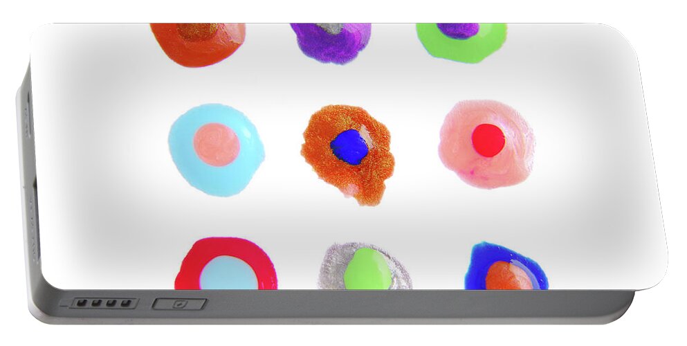 Nail Polish Portable Battery Charger featuring the photograph Close Up Of Color Drops Isolated On White by Severija Kirilovaite