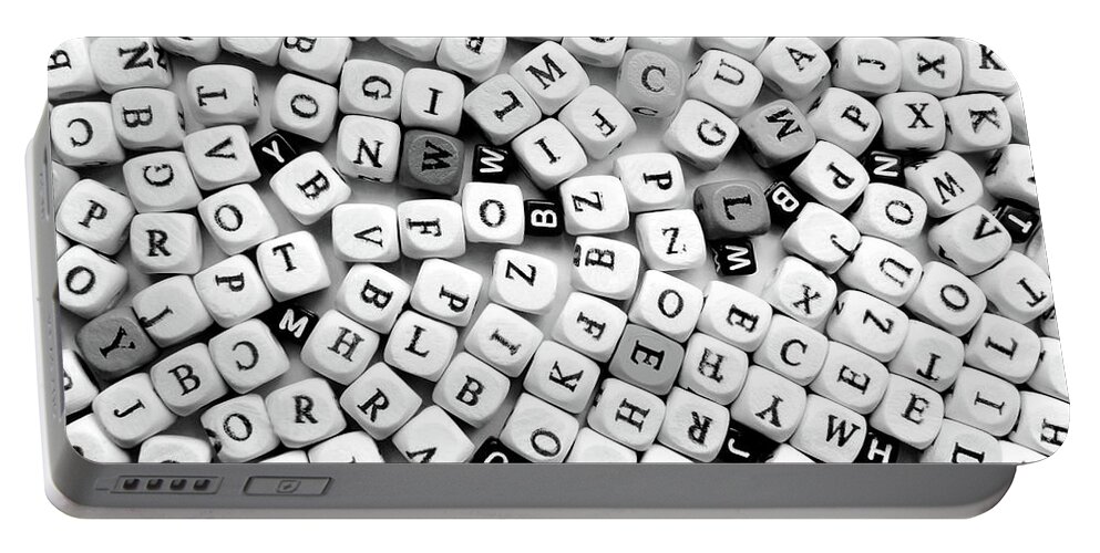 Different Portable Battery Charger featuring the photograph Closeup Of The Black And White Various Letters by Severija Kirilovaite