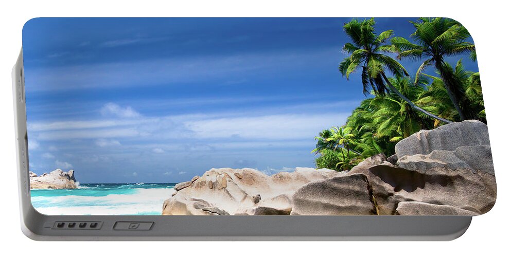 Bay Portable Battery Charger featuring the photograph Coconut trees and rocks in the Seychelles by Jean-Luc Farges