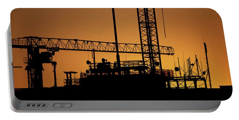 Construction Portable Battery Charger featuring the photograph Construction Site Sunset Silhouette by Artur Bogacki