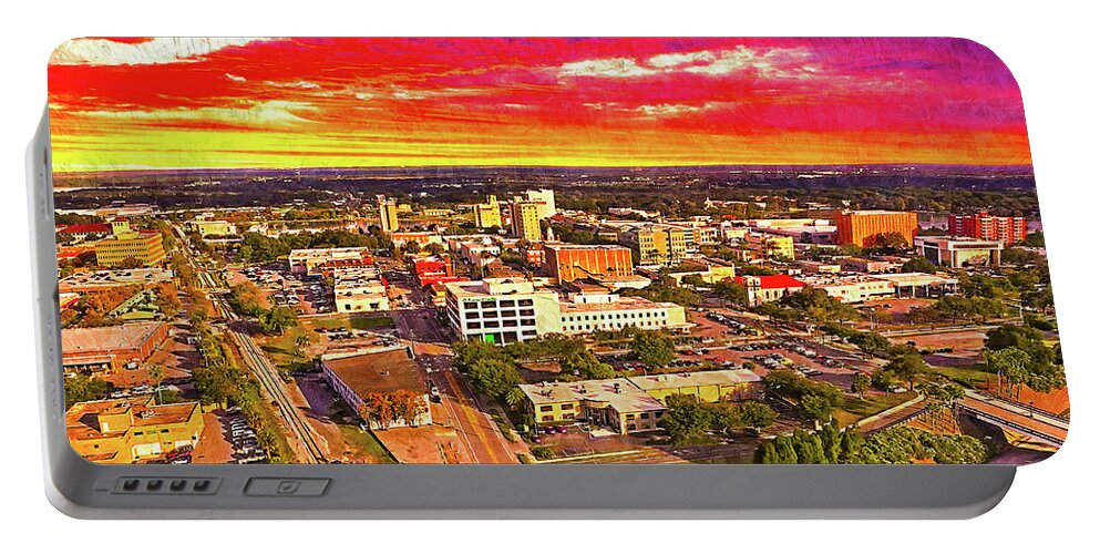 Downtown Lakeland Portable Battery Charger featuring the digital art Downtown Lakeland, Florida, at sunset - digital painting by Nicko Prints