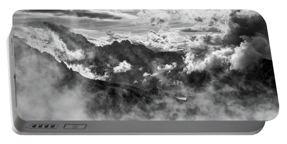 Mountain Portable Battery Charger featuring the photograph Dramatic Stormy sky and the mountain peaks of the Dolomites in S by Michalakis Ppalis