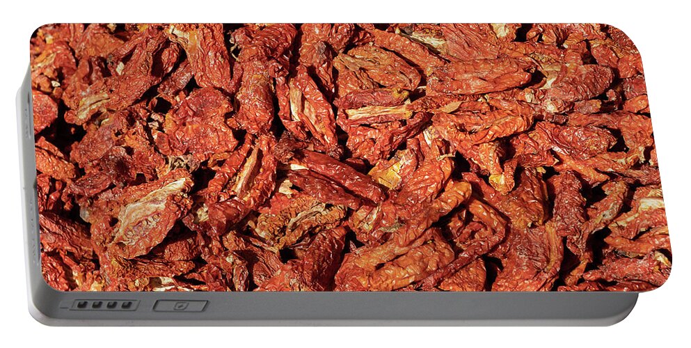 Fresh Portable Battery Charger featuring the photograph Dried Italian Tomatoes Background by Artur Bogacki