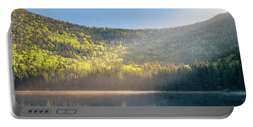 Mountain Portable Battery Charger featuring the photograph Early Morning Shaft of Sunlight Shines Down on East Pond Panoramic by William Dickman