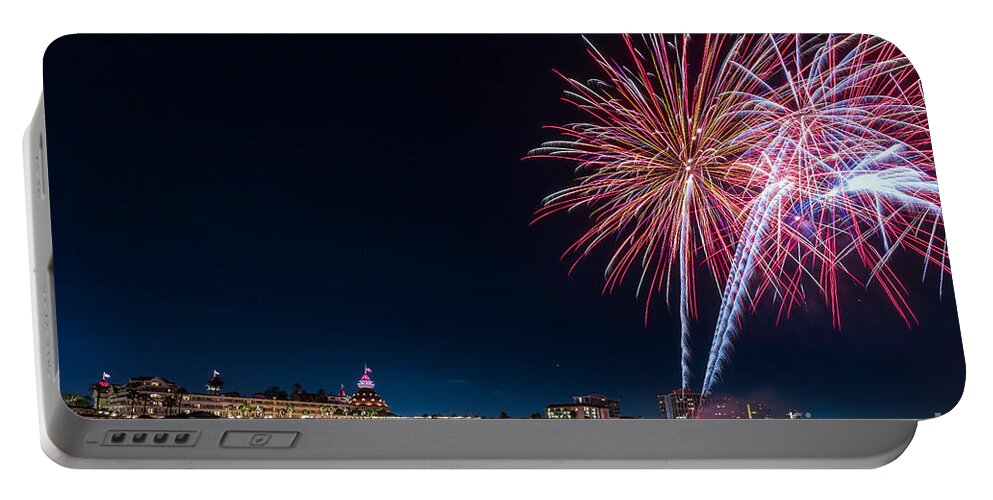 Resort Portable Battery Charger featuring the photograph Evening fireworks display at the Hotel del Coronado on the beach along the Pacific Ocean by Sam Antonio