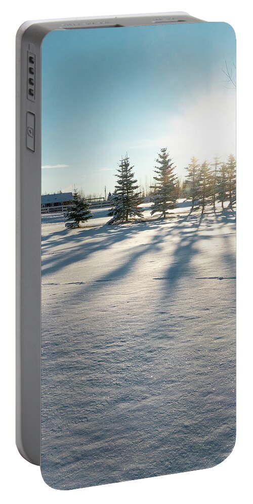 Evergreen Portable Battery Charger featuring the photograph Evergreen Shadows On Snow by Karen Rispin