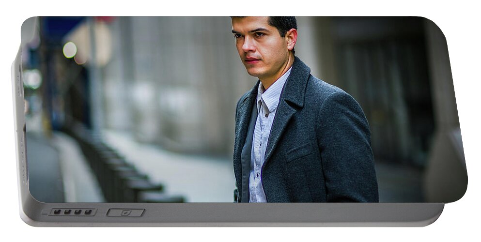 Young Portable Battery Charger featuring the photograph February on Street by Alexander Image