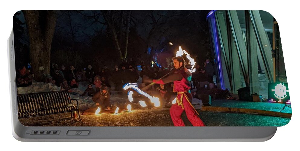 Winter Festival Portable Battery Charger featuring the photograph Fire juggler by Lisa Mutch