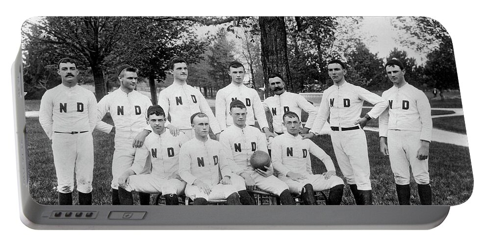 1880's Portable Battery Charger featuring the photograph First Notre Dame Football Team by Underwood Archives