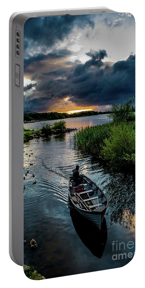 Ireland Portable Battery Charger featuring the photograph Fisher boat returns at sunset from Lough Leane in Killarney National Park in Ireland by Andreas Berthold
