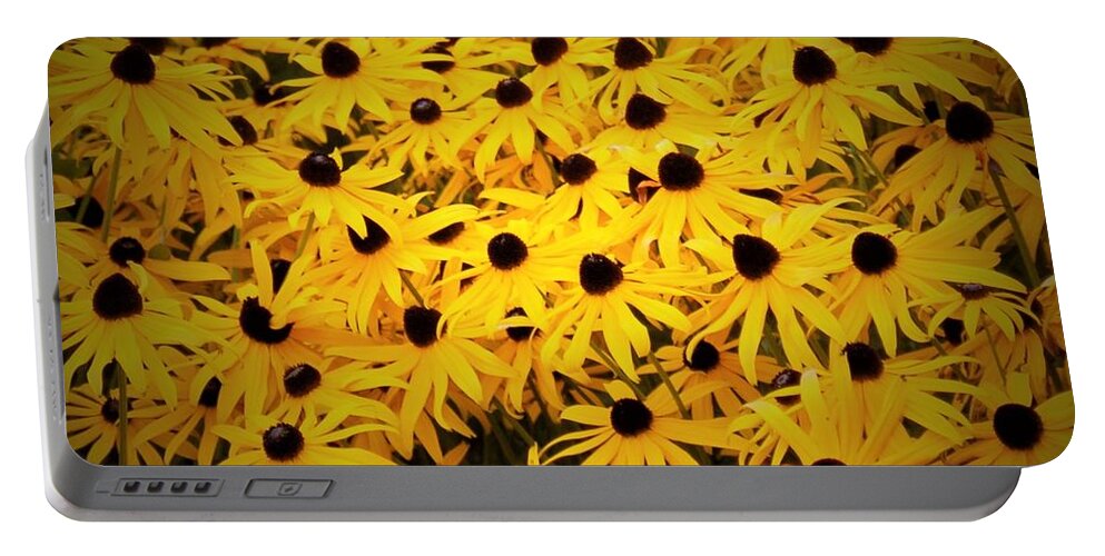 Yellow Portable Battery Charger featuring the photograph Flowers in full bloom by James Cousineau