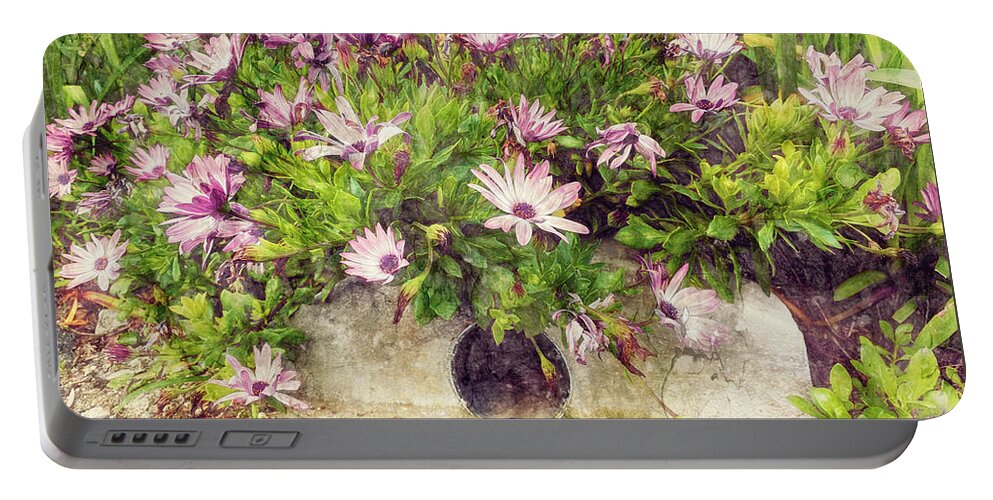 Pink Flowers Portable Battery Charger featuring the photograph Flowers over a Storm Drain by Davy Cheng
