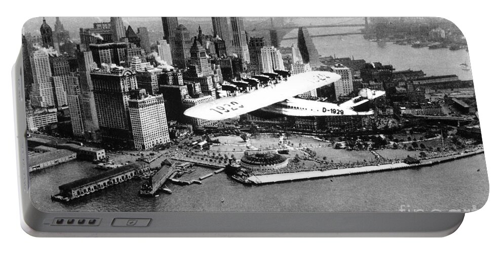 1930 Portable Battery Charger featuring the photograph FLYING BOAT - NEW YORK CITY, c1930 by Granger