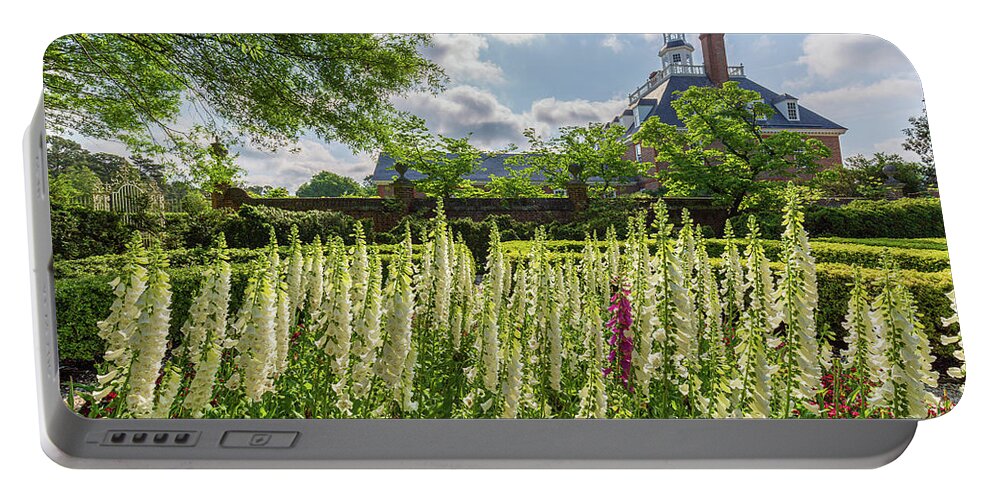 Colonial Williamsburg Portable Battery Charger featuring the photograph Garden Flowers at the Governor's Palace by Rachel Morrison