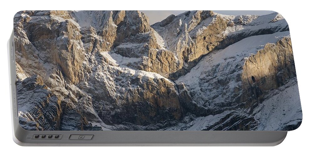 Gavarnie Portable Battery Charger featuring the photograph Golden Lights hits the snow capped peak of Pic de Marbore by Stephen Taylor