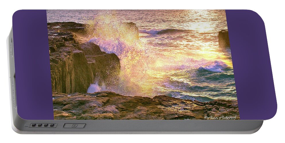 Rocks Portable Battery Charger featuring the photograph Golden Sea Spray by Alan Ackroyd