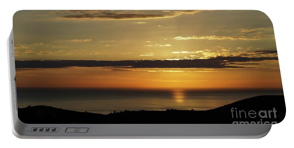 Clouds Portable Battery Charger featuring the photograph Golden sunrise over the sea by Adriana Mueller