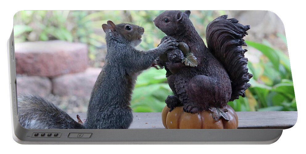 Squirrels Portable Battery Charger featuring the photograph Hand Over a Nut Please by Trina Ansel