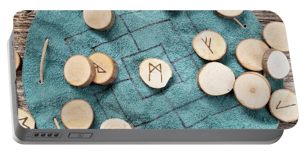 Runes Portable Battery Charger featuring the photograph Handmade runes for fortunetelling by Anastasy Yarmolovich
